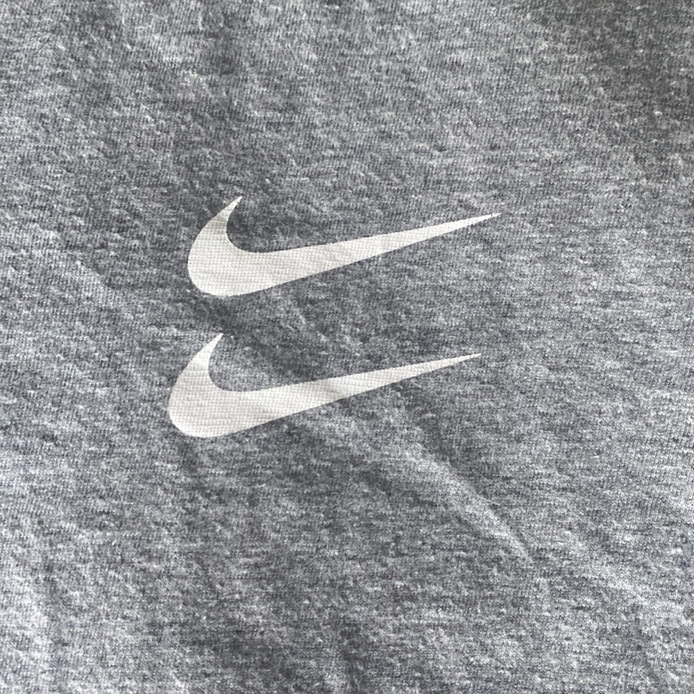 Grey nike tee shirt.